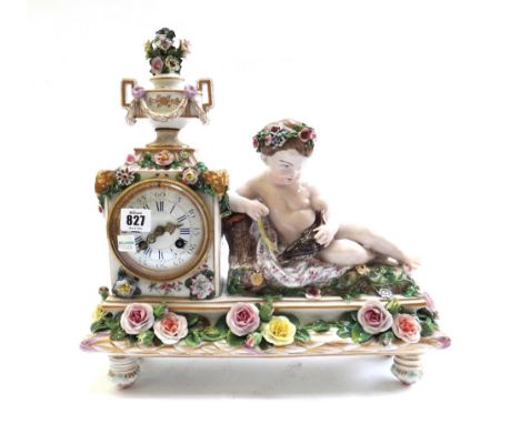 A Meissen style porcelain figural mantel clock, late 19th century, with a floral urn and swag finial over an enamelled dial, 