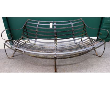 A late 19th century black painted semi-elliptic wrought iron bench, 220cm wide.