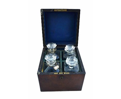 A Victorian figured walnut decanter box, the square lift top revealing a four decanter interior and Bramah lock, 24cm wide.  