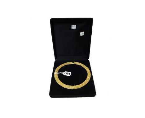 An 18ct gold collar necklace, in a multiple row ropetwist mesh link design, on a snap clasp, detailed 750 18 K Italy, weight 