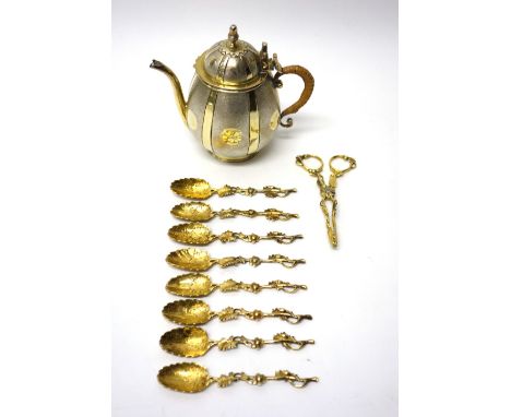 A parcel gilt silver teapot, of melon form, with a turned finial, the body with texturing to the panels and with a rush woven