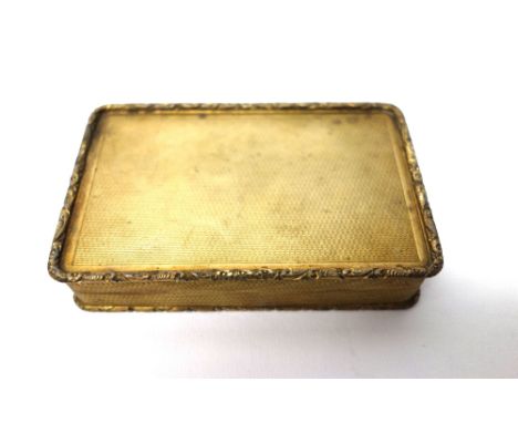 A silver gilt rectangular hinge lidded snuff box, with engine turned decoration and having scroll moulded borders, London 196