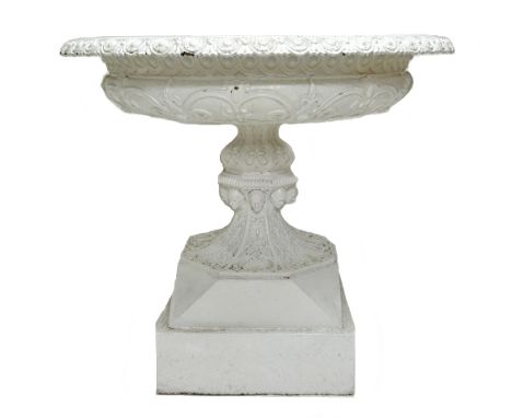 A Victorian white painted cast iron urn or fountain attributed to Andrew Handyside Foundry. The upper socle cast with the por