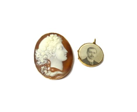 A gold mounted oval shell cameo brooch, carved as the portrait of a classical lady, probably Flora with a cornucopia, detaile