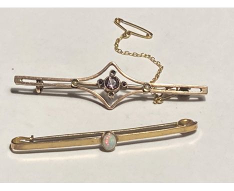 TWO 9 CARAT GOLD BAR BROOCHES ONE WITH AN AMETHYST AND ONE WITH AN OPAL 