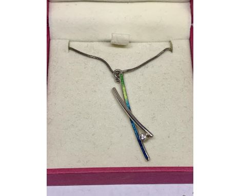 A SILVER AND ENAMEL NECKLACE IN A PRESENTATION BOX 