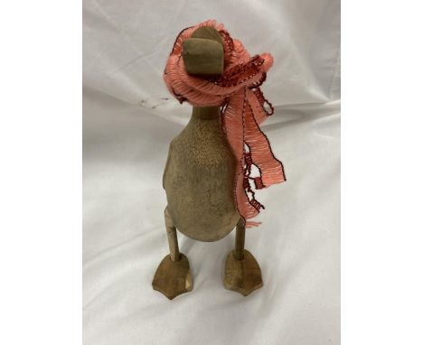 A WOODEN DUCK WITH SHAWL 