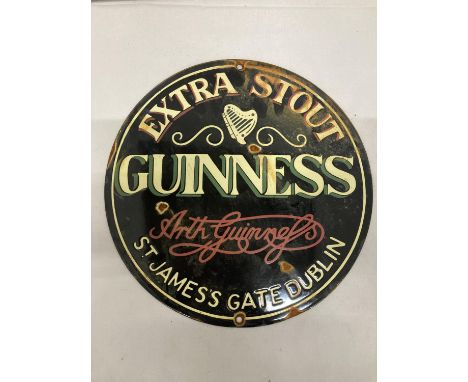 AN ENAMEL EXTRA STOUT GUINNESS CIRCULAR SIGN 