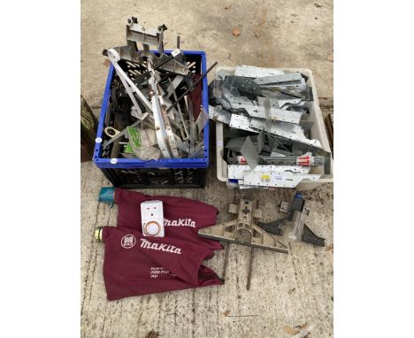 AN ASSORTMENT OF METAL WALL BRACKETS AND TOOL GUIDES ETC 