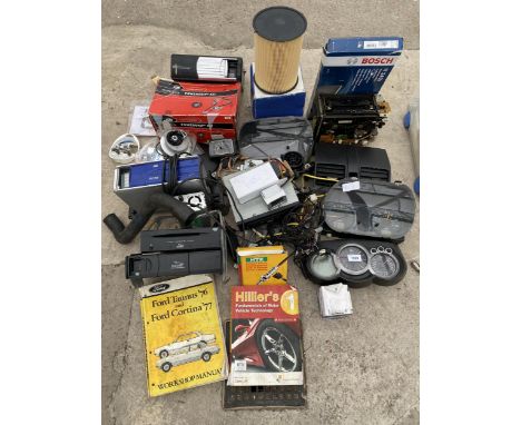 AN ASSORTMENT OF AUTOMOBILE SPARES TO INCLUDE DASH BOARD INSTRUMENTS AND RADIOS ETC 