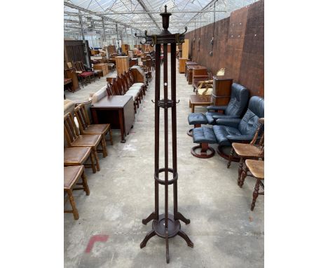 AN EDWARDIAN CIRCULAR COAT/STICK STAND 