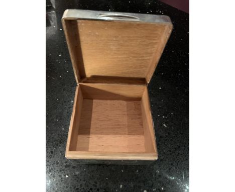 A HALLMARKED LONDON SILVER BOX , 850MM X 850MM HIGH , 450MM WIDE , WEIGHT IS 270GMS . WOODEN INSERT . DONATED TO SOMEONE IN T