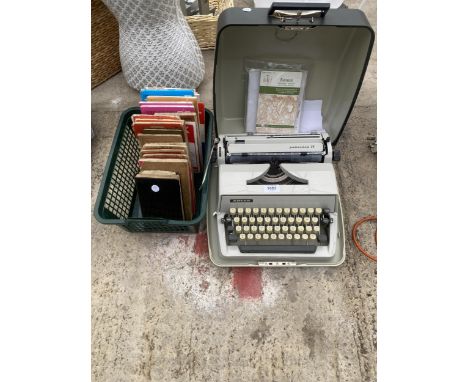 A RETRO GABRIELE 25 TYPEWRITER AND AN ASSORTMENT OF MAPS 