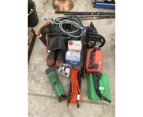 AN ASSORTMENT OF ITEMS TO INCLUDE A TITAN PETROL CHAINSAW, TWO PETROL CANS AND WELLIES ETC 