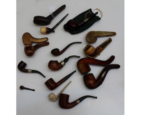 A collection of fourteen Meerschaum, briar and other pipes, including a Peterson of Dublin Spigot pipe with silver collar