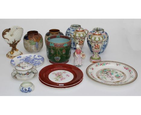 A group of European ceramics to include a pair of 19th century Delftware melon form vases, a pair of Doulton ovoid vases, an 