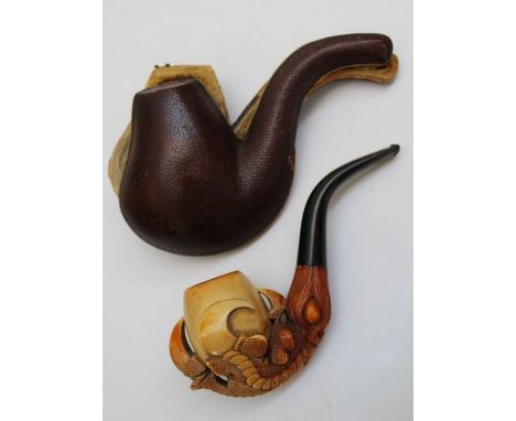 A Meerschaum pipe, the bowl well carved with dragons claws, to an ebonised stem, 16.5cm, cased