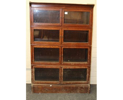 A pair of Globe Wernicke type oak and line inlaid bookcase of typical form having each four glazed shelves , one with label B