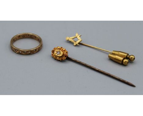 A selection of yellow metal jewellery comprising a pair of stick pins, one a diamond set Victorian pin in 15ct, an eternity r