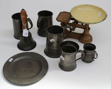 An ARP hand bell, two 19th century pewter terrine moulds, seven 25cm pewter plates, nine tankards/measures and a set of cast 