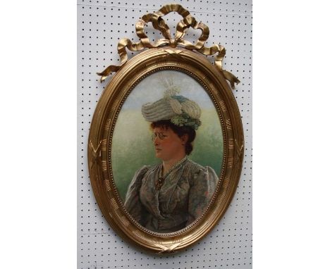 19th century European School, half length portrait of a bespectacled lady, wearing turban and florally printed gown. Oil on c