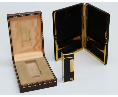 A black enamel and gold tone Dunhill lighter (boxed) plus a black leather cigarette case(boxed) (2)