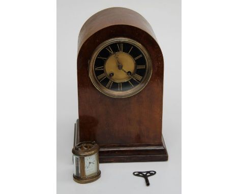 An early 20th century mahogany dome case mantle clock with eight day gong striking&nbsp; movement, 34cm together with a small