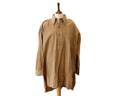 A Second World War army officer's khaki drill shirt bearing a Pilot Brand label inscribed "Guaranteed Government Fast Dye"