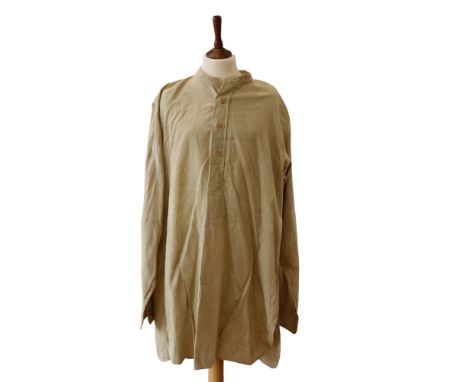 A second World War army officer's khaki collarless half front opening shirt