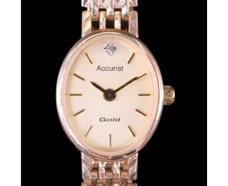 A lady's 9 ct gold Accurist wristwatch, having an electronic Miyota 5R21 movement, diamond-set face, gilt baton hands and mar