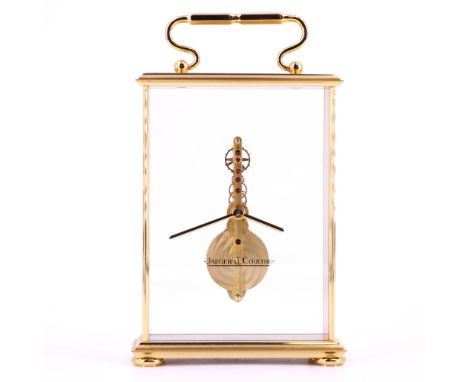 A Jaeger-LeCoultre skeleton clock, ref. 569, having a "floating" 16-jewel vertical in-line 8-day movement with slender pencil