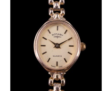 A lady's 1990 Rotary 9 ct gold dress wristwatch, having a quartz movement, oval face and open bead-link flexible bracelet str