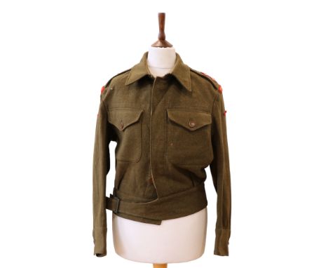 A 1943 US War Aid Battle Dress Blouse bearing the insignia of a Durham Light Infantry lieutenant