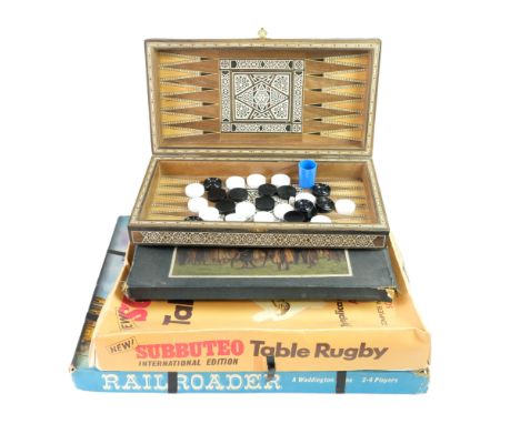 Four vintage board games including Subbuteo Table Rugby, Minoru and Railroader