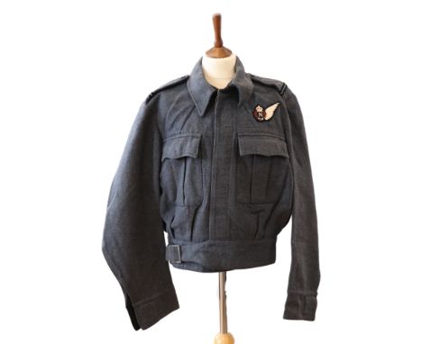 A 1943 RAF Aircrew [ Battledress ] Blouse bearing a Royal Canadian Air Force Navigator's brevet and Pilot Officer rank insign