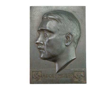 A German Third Reich bronzed base metal alloy Adolf Hitler relief portrait profile plaque, bearing the sculptor's initials KB