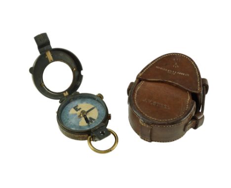 A 1910 date British army prismatic marching compass and leather case, each marked with the name J V Steel 