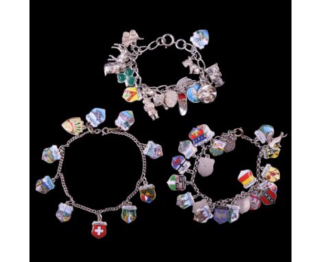 Three vintage white metal charm bracelets including European enamelled shield charms, 79 g