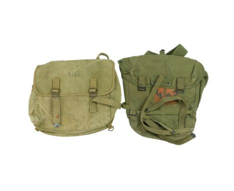 A Second World War US Army M 1936 Musette Pack together with Combat Pack 