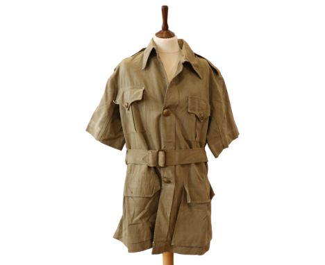 An inter-War / Second World War British army officer's khaki drill bush shirt, having a quilted spine pad, inscribed "Capt Jo