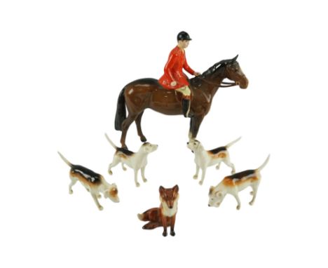 A Beswick huntsman together with a fox and four hounds, fox (a/f), tallest 21 cm