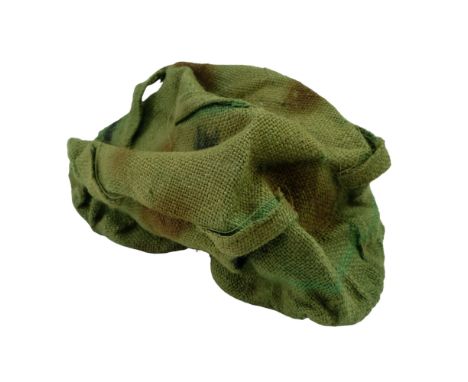 A Second World War British army hessian camouflage helmet cover