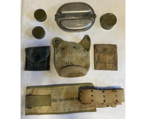 A set of Second World War US Army meat cans, 1945 dated, together with a water bottle pouch, magazine pouches, ration and fue