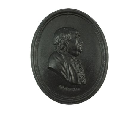 A late 18th / early 19th Century Leeds Pottery black basalt relief portrait plaque of Benjamin Franklin, bearing impressed "L