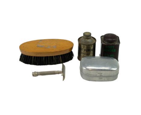 A group of Second World War British Army issue personal kit including a 1945 dated soap tin and razor, a 1940 hair brush and 