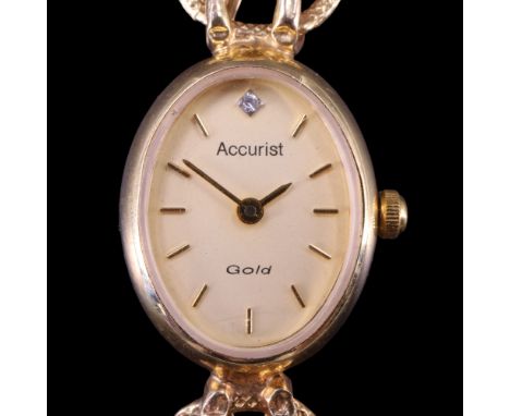 A lady's 2003 Accurist "Gold" 9 ct gold dress wristwatch, having a quartz movement and oval face set with a diamond at 12 o'c