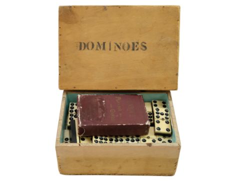 A boxed set of Victorian bone and ebonised wood double-nine dominoes together with The "Unique" playing cards