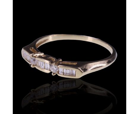 A diamond ring, comprising trios of bar-set baguette cut diamonds divided by claw-set brilliant on 9 ct gold, R/S, 1.9 g