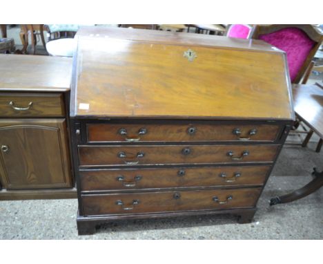 GEORGE III MAHOGANY BUREAU, FALL FRONT WITH AN INTERIOR WITH SMALL DRAWERS AND PIGEONHOLES OVER A FOUR DRAWER BASE WITH BRASS