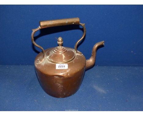 A copper kettle having acorn finial.